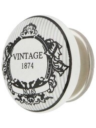 White Porcelain 1874 Vintage Label Cabinet Knob with Brass Base in Polished Nickel.